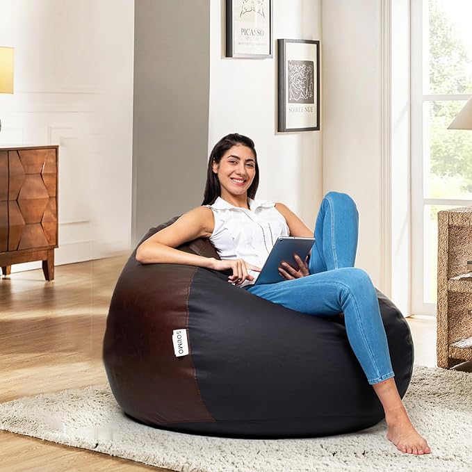 a woman sitting on a bean bag chair